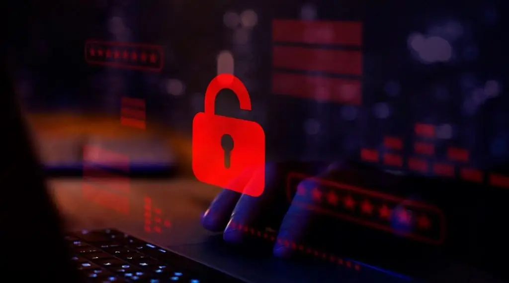 Symbole de cadenas rouge déverrouillé sur écran d’ordinateur – illustration d’une cyberattaque par rançongiciel